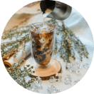 a glass of milk coffee with ice